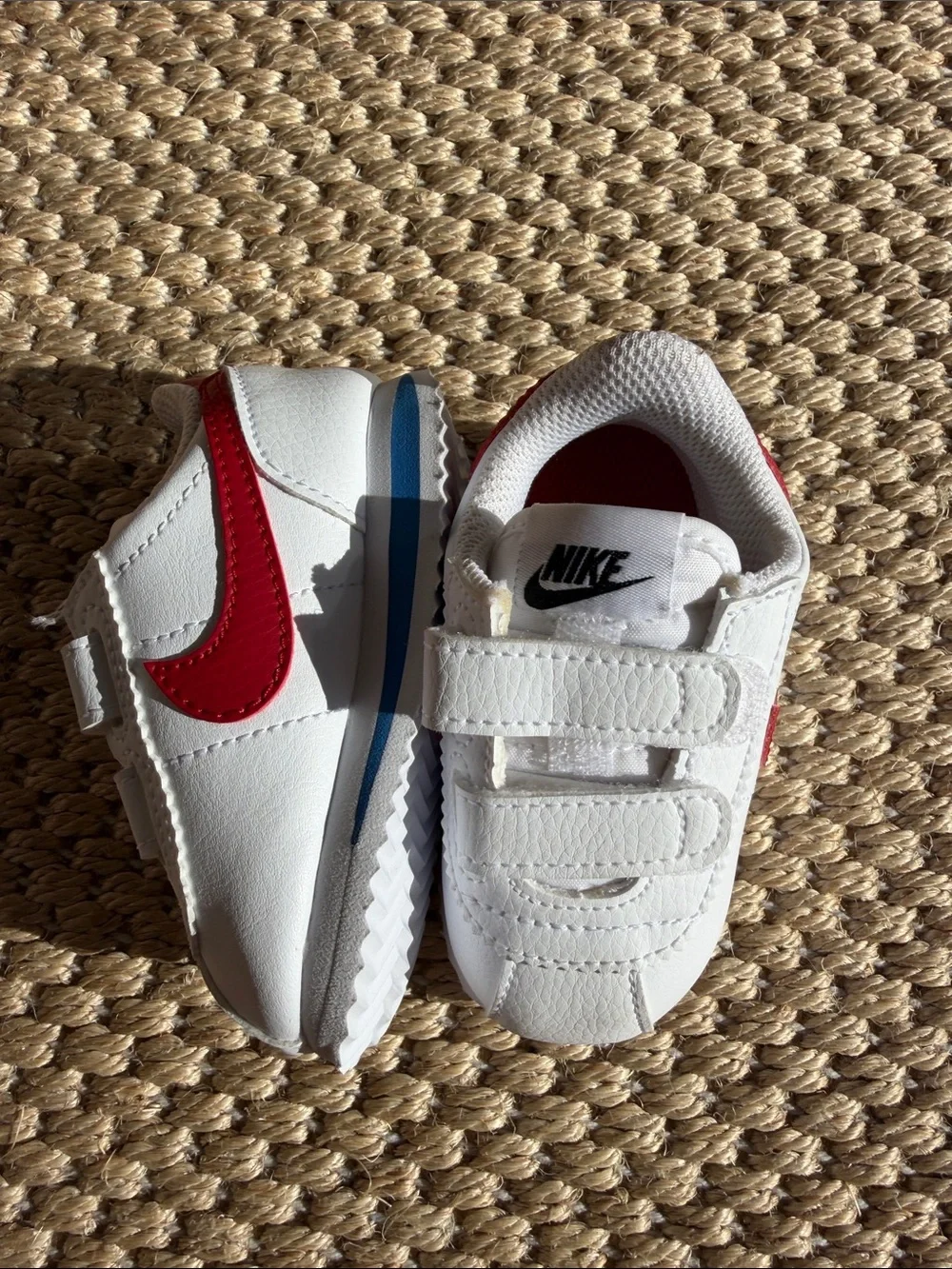 Nike White Baby Sneakers with Red Swoosh and Blue Accent size 4c